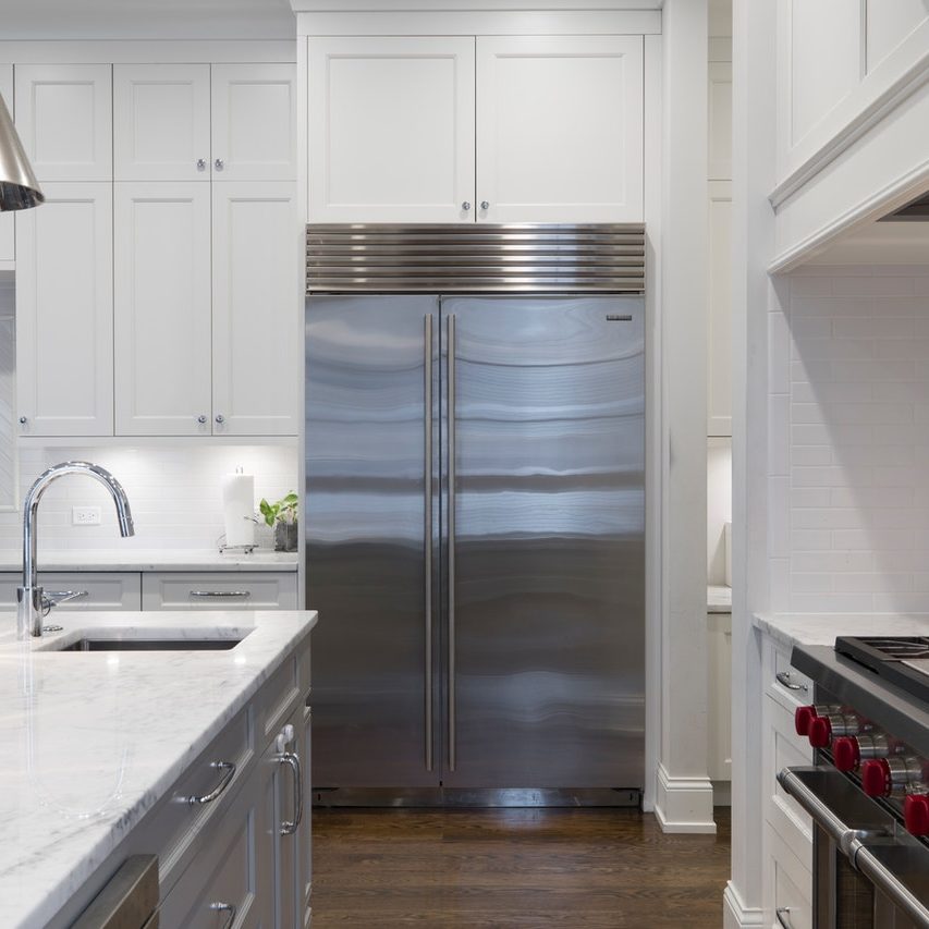 stainless-steel-refrigerator-beside-white-kitchen-cabinet-2343467